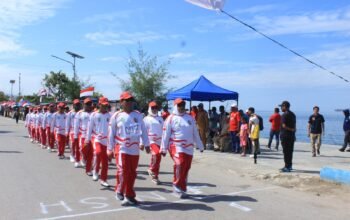 Tampil Kompak Balutan Merah Putih, Dinas Sosial Fakfak Semarakkan Gerak Jalan HUT RI ke-81